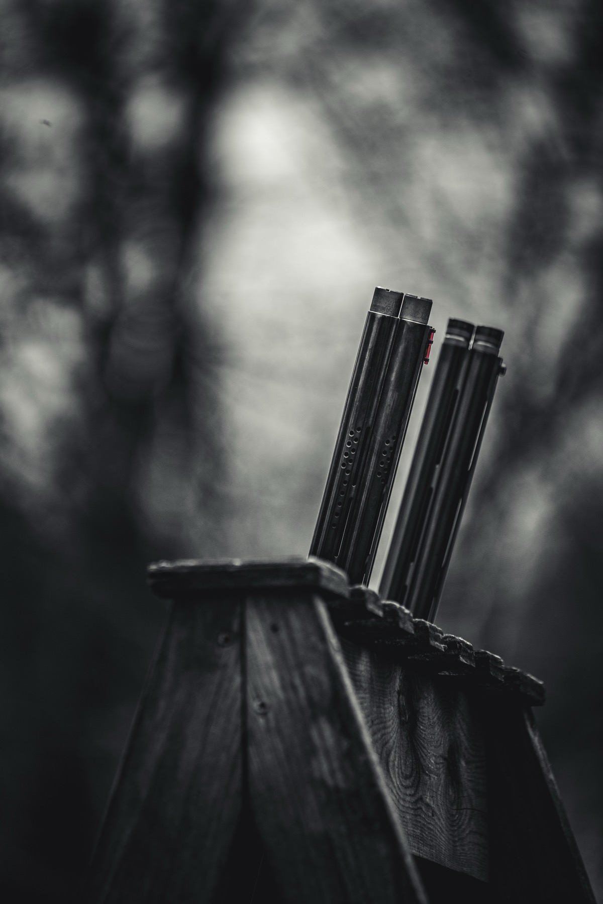 A close detail of dark barrels and weathered wood.